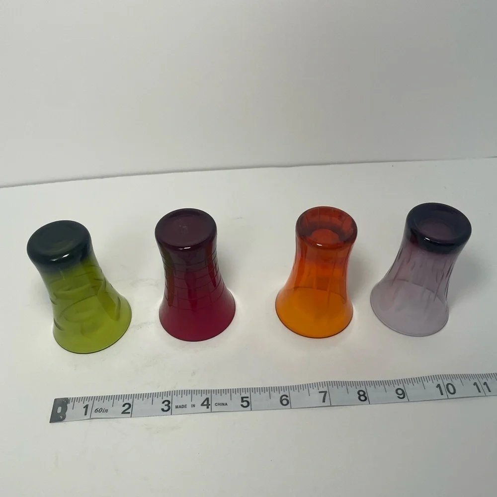 Vintage patterned multicolored shooter glasses.